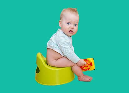 toddler sitting on a potty