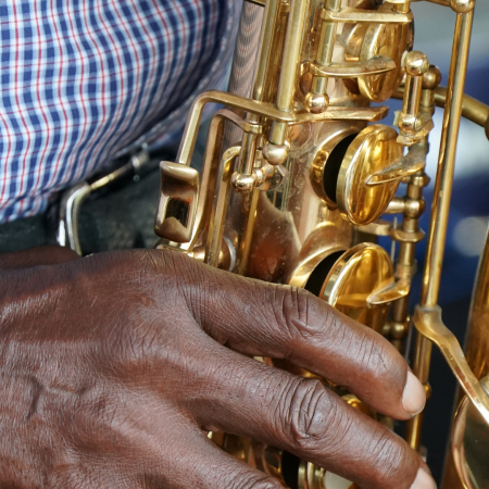Image of a man playing a saxophone