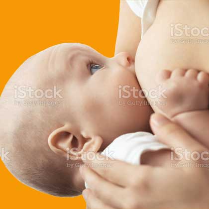 woman breast feeding a baby