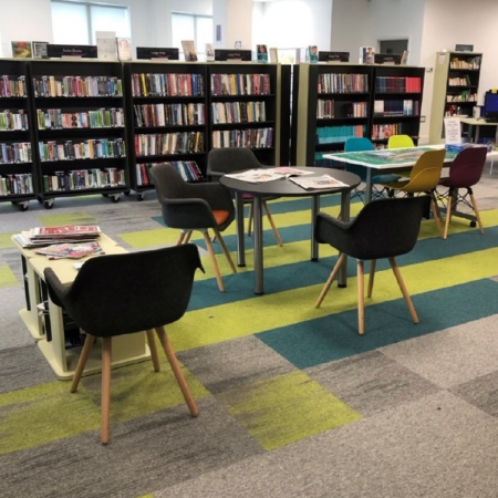 Image of a table and tables inside a library room