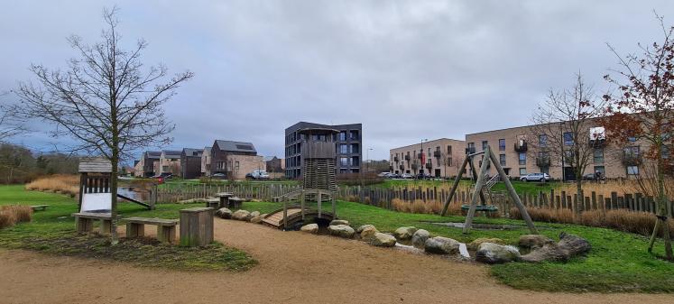 Photo of the outdoor play area at Elmsbrook, Bicester showing natural play equipment.